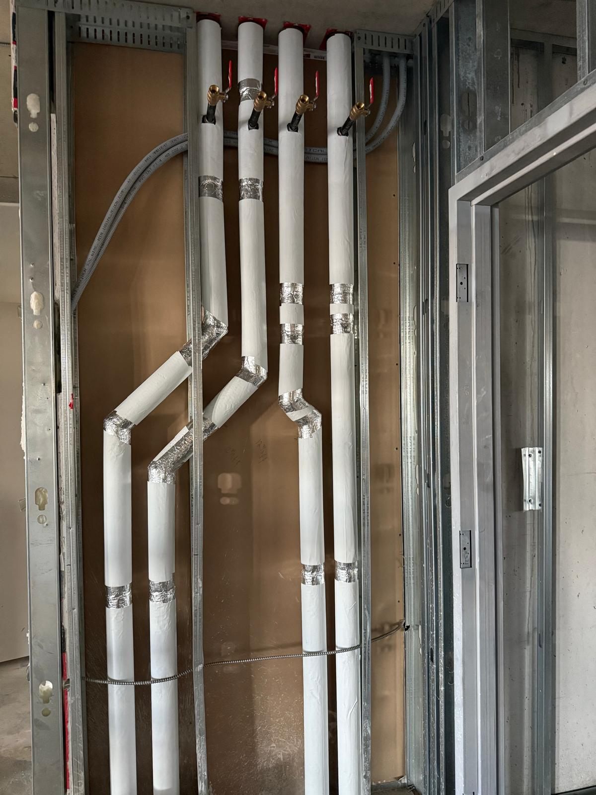 Insulated piping installation in mechanical chase